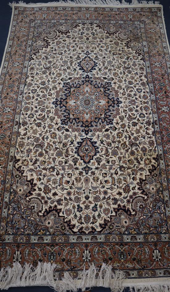 A Kashan style ivory ground rug 218 x 136cm